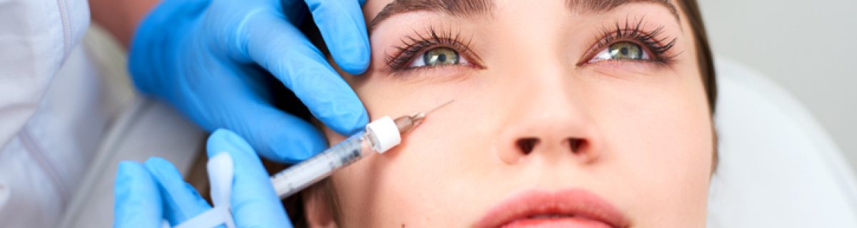 Beautician doctor in medical gloves with syringe injects botulinum under eyes for rejuvenating wrinkle treatment. Filler injection for under eye wrinkles smoothing. Plastic aesthetic facial surgery in beauty clinic